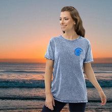 Load image into Gallery viewer, Super sexy high quality woman's blue washed denim t-shirt for the true seaman in all of us. Or is it a true poet? Rugged nature enthusiast? Luxuriously aged for a perfect fit with your inner self and our Vourvourou setting