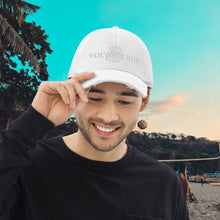 Load image into Gallery viewer, A perfectly understated summer baseball hat with white on white embroidery. Flows seamlessly with the Greek summer lifestyle. Chill on the beach, sail the Aegean, sip your iced coffee. Each hat is individually embroidered in Europe when you order.